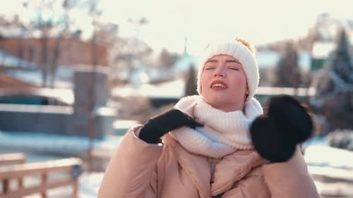 Young Woman Dressed Winter Jacket White Knitted Hat and Scarf Standing Outdoor on Winter City Street