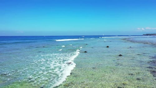 Aerial top down texture of tranquil sea view beach holiday by blue green sea and bright sand backgro