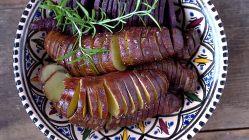 Roasted Potatoes and Rosemary on Decorative Plate