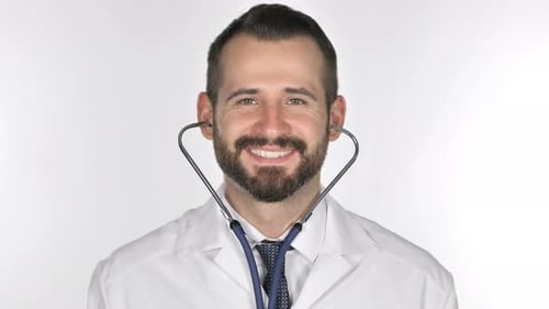 Smiling Doctor Puts On Stethoscope in Close Up
