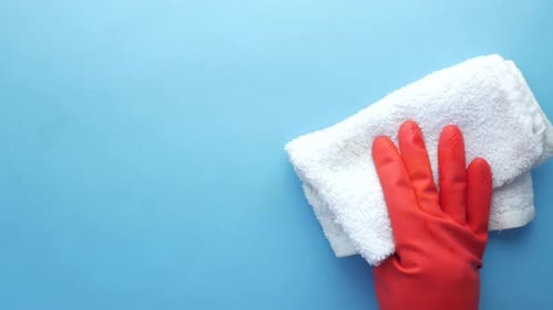Top View of Person Hand Cleaning Table with Cloth