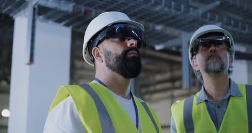 Engineers Using Augmented Reality in Warehouse