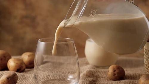 Potato Milk Being Poured into a Glass