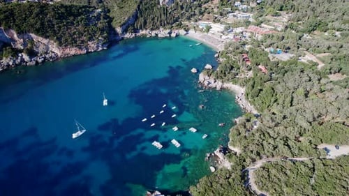 Aerial Drone View to Clear Blue Sea Water with Moored Boats and Yachts
