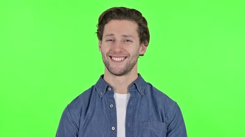 Young Man Smiling at the Camera on Green Chroma Key