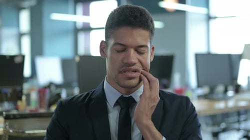 Portrait of Sick African Businessman Having Toothache