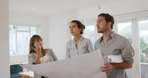 Millennial creative professionals working in a creative office