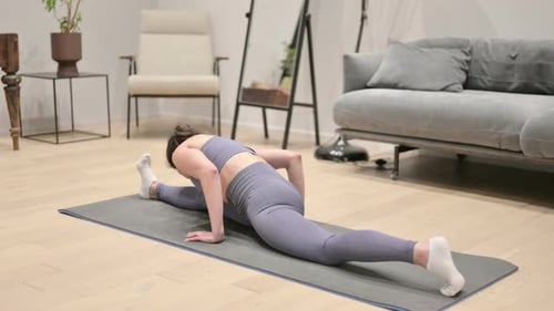 Woman Doing Splits and Stretching at Home