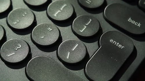 Close Up of Black Computer Keyboard with Round Keys