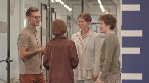 Team of Colleagues Giving High Five Together in Office