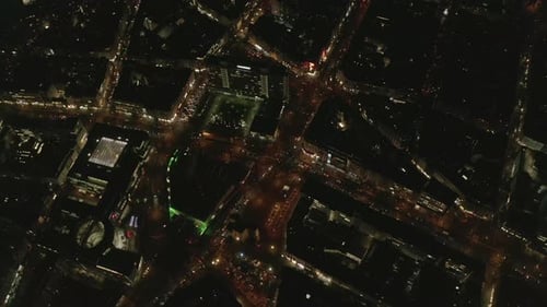 AERIAL: Slow Overhead Shot of City at Night with Lights and Traffic, Cologne, Germany