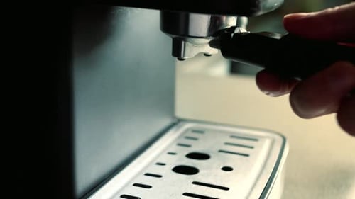 Person Making Espresso at Home