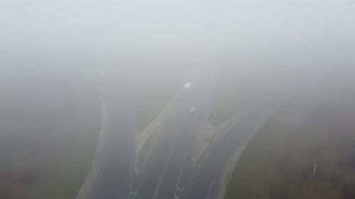 Strong Fog on the Road Aerial Drone View