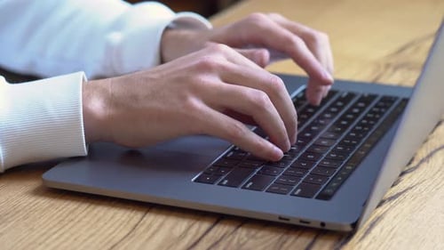 Close up of Hands Typing on Laptop Keyboard