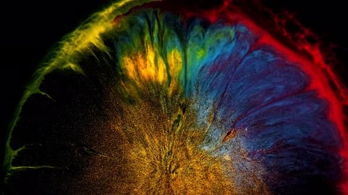 Colorful Ink Explosion with Gold Particles on Black