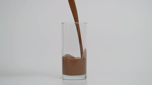 Super Slow Motion of Filling Transparent Glass with Chocolate at 1000 Fps