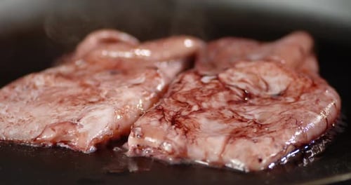 Squid Cooking on a Flat Top Grill