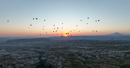 Aerial Cinematic Drone View of Colorful Hot Air Balloon Flying Over Cappadocia