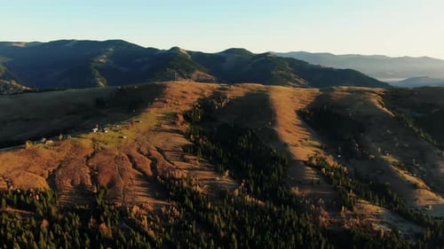 Majestic Drone View of Mountain Range Covered with Green Trees on Sunny Day in Nature