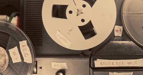 Vintage Open Reel-to-Reel Tape Recorder with Spinning Reels