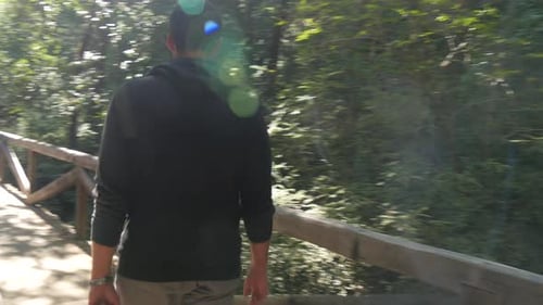 Guy Walking on the Bridge
