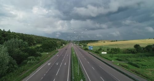 Highway On A Background Of Cloudy Sky With Low Cloud