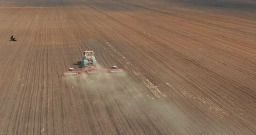 Tillage By Mechanized Agricultural Machinery Tractor Plowing Land View From Drone Prores