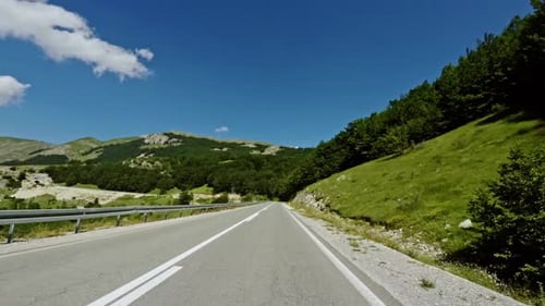 Road Trip Through Hilly Terrain - POV View.