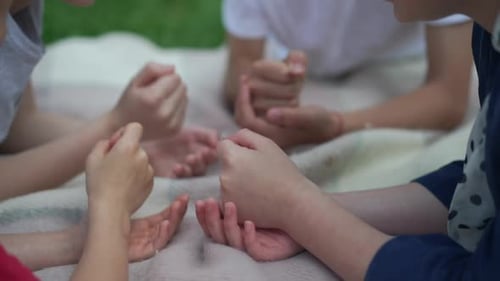 Caucasian Children Playing Rock Paper Scissors Gesturing in Slow Motion Outdoors
