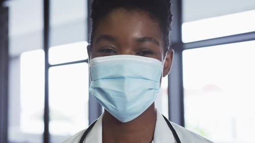 Health Professional Wearing Surgical Mask in Hospital Setting