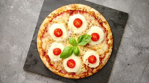 Close-Up of Delicious Pizza with Tomatoes and Basil
