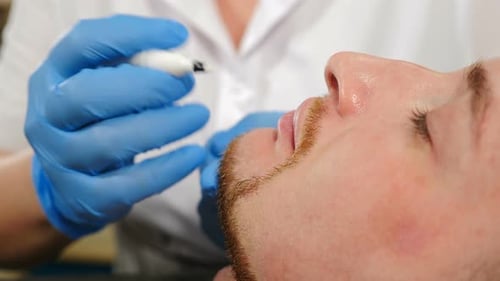 Man Gets Lip Treatment at Medical Clinic