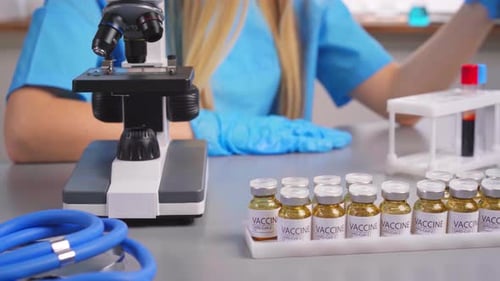 Scientist Working with Vials of SARS-COV-2 Vaccine