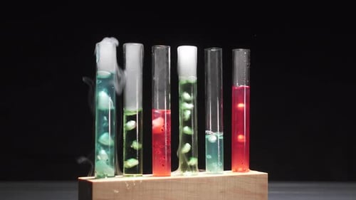 Test Tubes with Colorful Fluids and Smoke