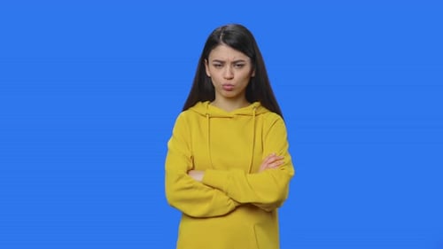 Woman in Yellow Hoodie Looking Annoyed