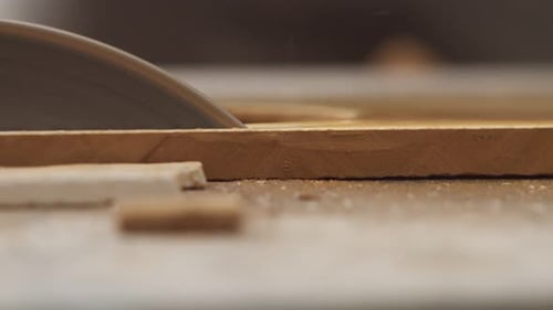 A worker cuts tile with a disc, closeup. Ceramic tiles are sawn with diamond disc