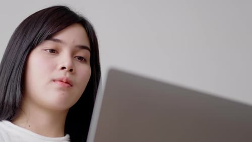 Woman Using Laptop Computer Indoors, Close Up
