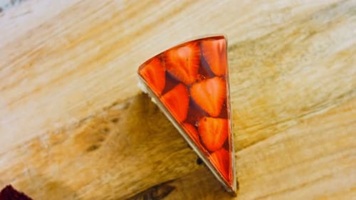 Strawberry Jelly Cake Close Up Displayed on Wood