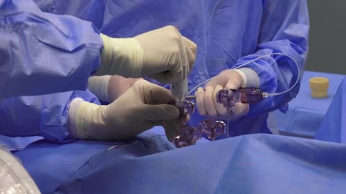 Surgeons Perform Laparoscopic Surgery in Hospital Operating Room