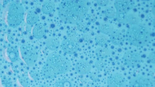 Abstract Bubbles and Droplets on Blue Background