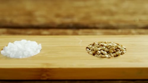 Spices and Salt on a Wooden Cutting Board