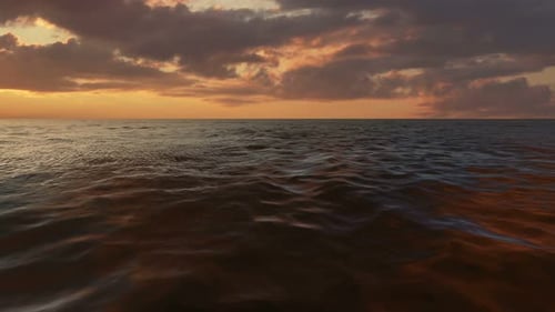 Calm Ocean Waves at Sunset Seamless Loop