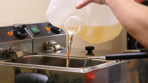 Adding Oil to Industrial Deep Fryer
