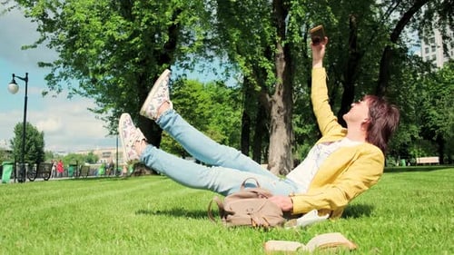 Adult Woman Taking Selfie in Green Park