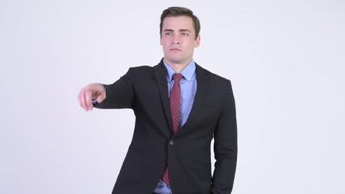 Businessman Smiling and Gesticulating with Hand