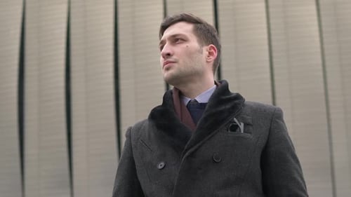 Close up view of a businessman wearing a coat