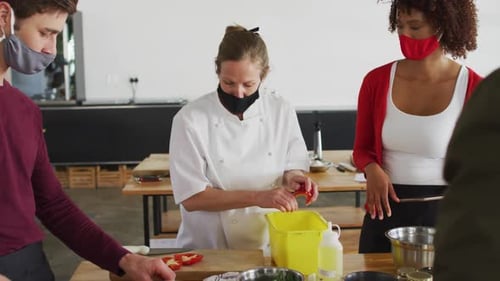 Adults Learning in Cooking Class with Face Masks
