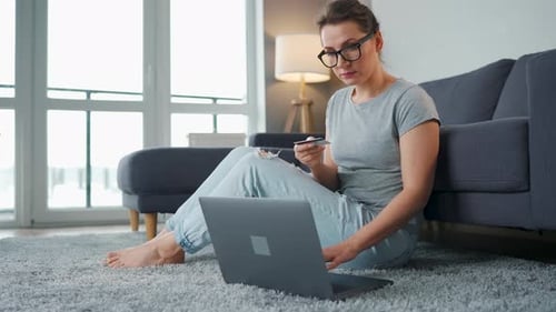 Woman Shopping Online with Laptop and Credit Card