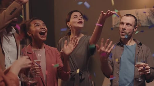 Friends Celebrate Together with Confetti and Champagne