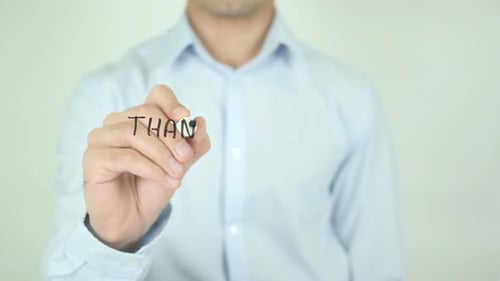 Man Writes Thank You Message on Glass